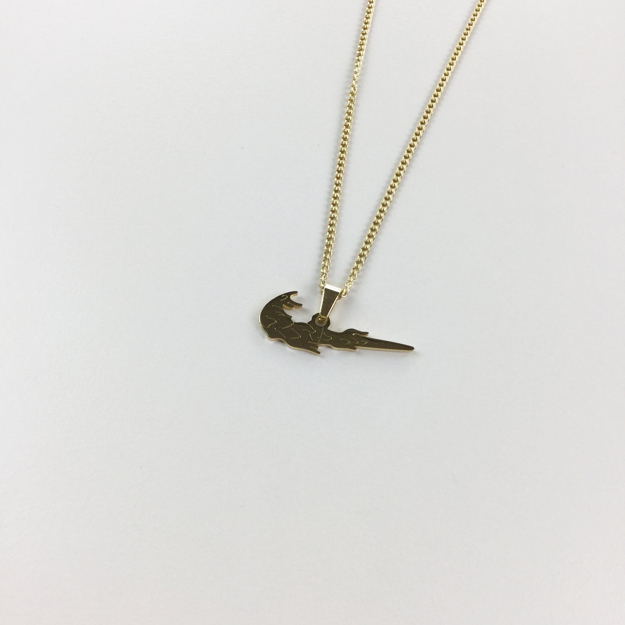 Nike gold pendant Clearance
